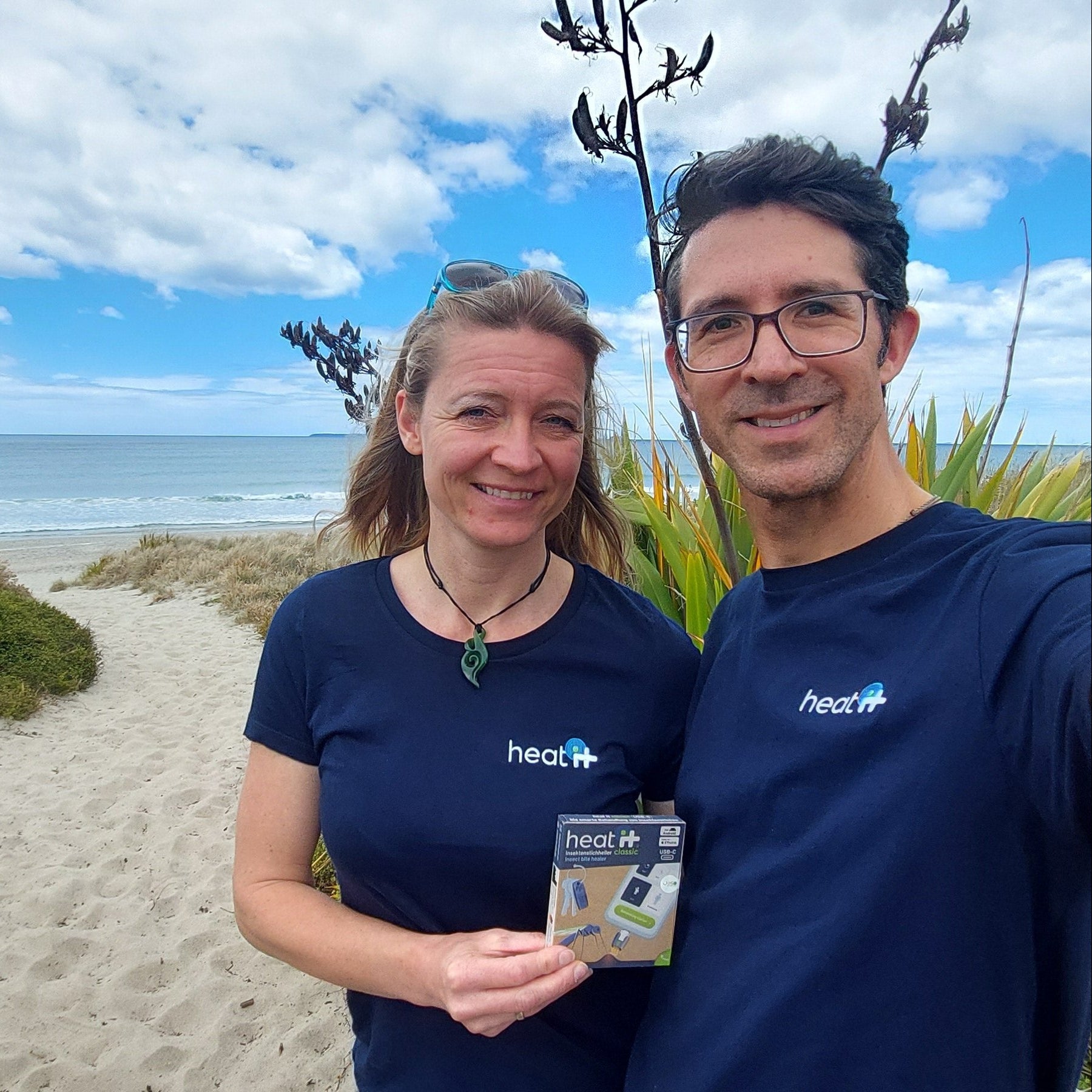 Monika and Norbert Bliesze, the team behind heat it® NZ, at Papamoa Beach with the heat it® insect bite relief device.